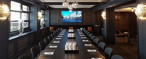 Dark-Toned Meeting Room with Street Views in Oslo
