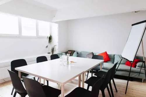 Minimalistic Space With Colourful Accents for Group Discussions