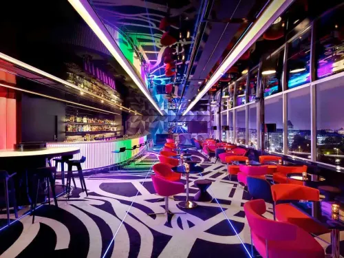 Neon-Lit Skyline Bar With Striking Geometric Aesthetics for Cocktail Receptions