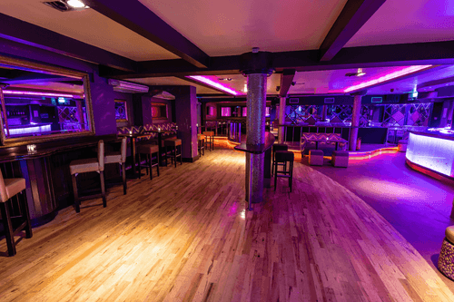 Vibrant Art Deco Club With Neon Lighting for Energetic Corporate Mixers