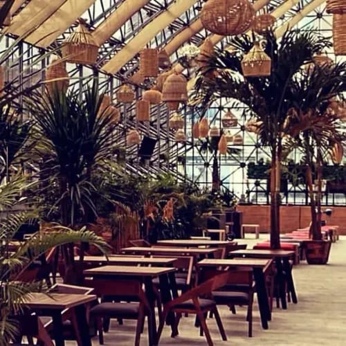 Tropical Glasshouse Rooftop With a Luxe Poolside for Lively Parties