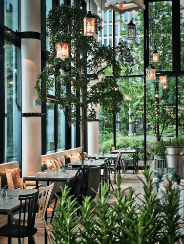 Charming Glasshouse With Lush Greenery for Casual After-Work Events