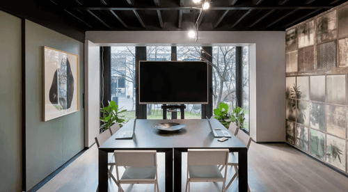 Glass-Walled Boardroom With Garden Access and Artful Decor for Executive Events