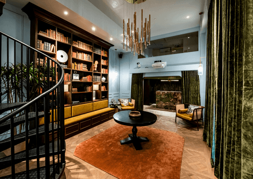Boutique Library With Brass Chandelier for Creative Gatherings