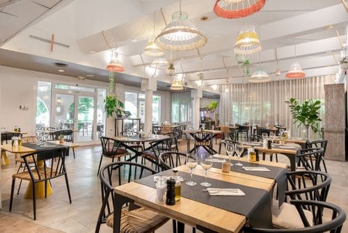 Bright, Eclectic Bistro With Woven Charms for Inspiring Team Dinners