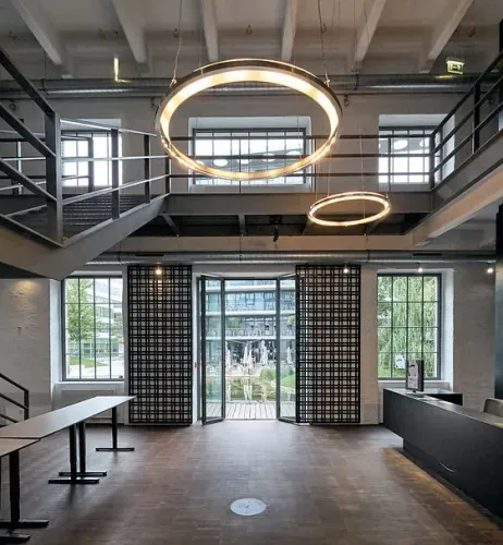 Striking Industrial Atrium With Futuristic Lighting for Receptions and DJ Nights