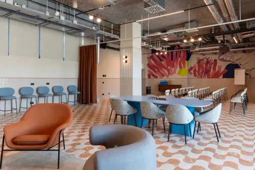 Industrial Meeting Studio With Art Wall and Breakout Lounge