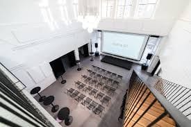 Industrial Two-Level Hall With Projector Setup for Talks