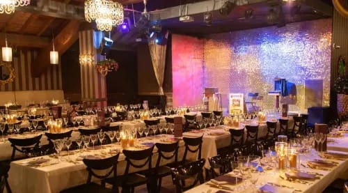 Glamorous Rustic Venue With Shimmering Wall Backdrops for Networking Soirees