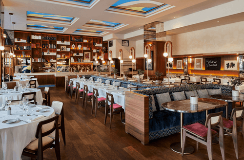 Mid-Century Dining Room With Rich Wood and Art Deco Touches for Social Business Events