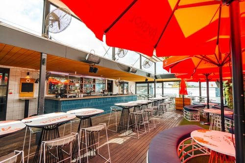 Vibrant Outdoor Patio With Wooden Charm for Relaxed Social Gatherings