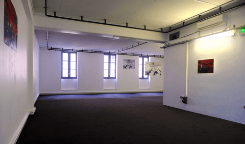 White Minimalist Space With Historic Charm for Exclusive Brand Launches