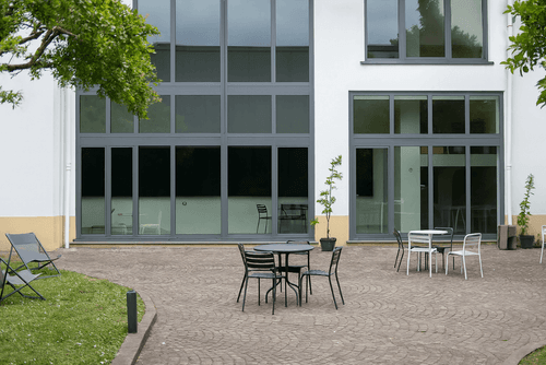 Tree-Lined Courtyard With Cobblestone Pavement for Outdoor Events