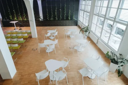 Open-Plan Event Space With Greenery for Conferences and Networking
