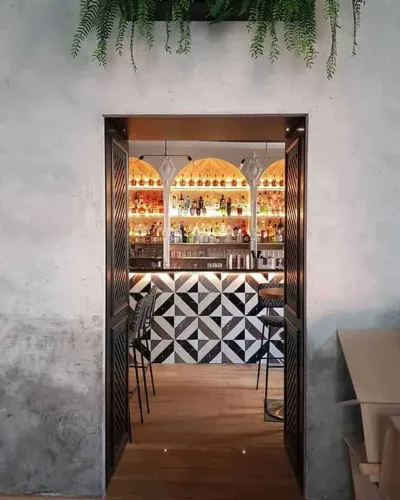 Lush Industrial Brasserie With Cascading Greenery for Chic Corporate Mixers
