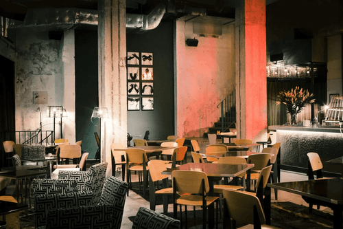 Raw Concrete Lounge With Retro Vibes for Artful Evenings