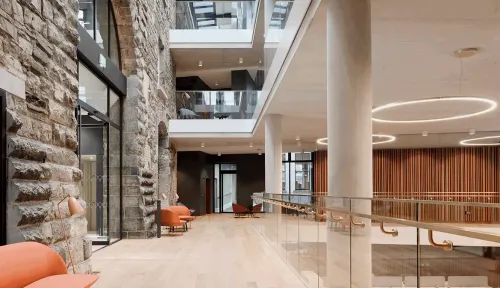 Light-Filled Contemporary Mezzanine With Striking Stone Façade for Executive Receptions