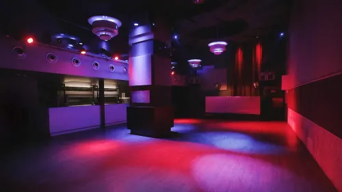 Striking Arched Club With Colourful Lighting for Cocktail Receptions