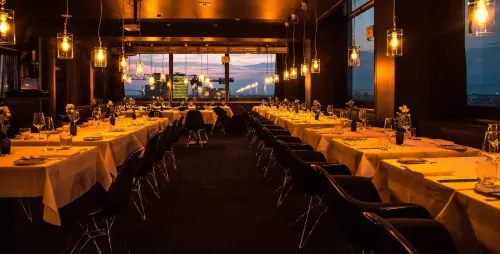 Glass-Enclosed Rooftop Venue With Panoramic City Views for World-Class Dining