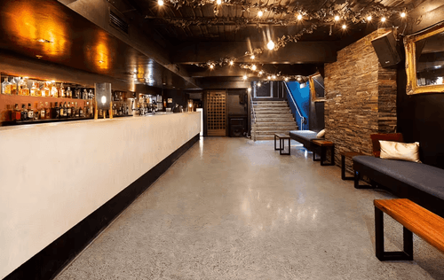 Modern Industrial Venue With Rustic Stone Walls for Stylish Corporate Events