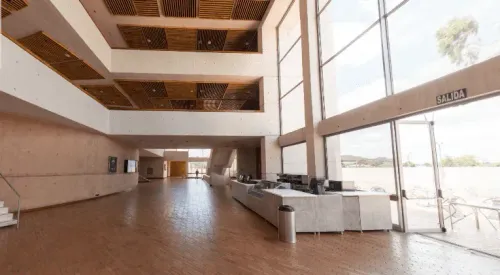 Sunlit Scandinavian Foyer With Expansive Glass Walls for Networking Events