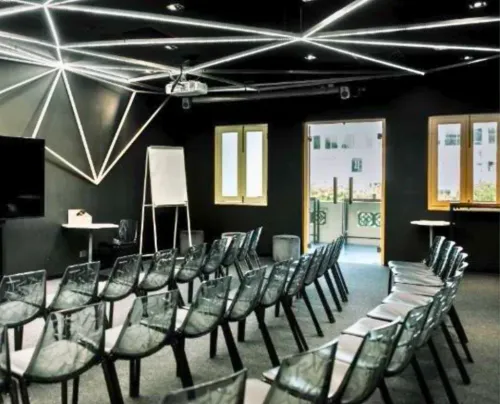 Sculptural Led-Lit Room With Faceted Walls and Balcony for Pitch Deck Presentations