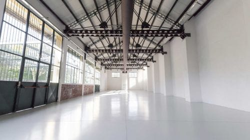 Industrial Hall With Warehouse Windows and Courtyard for Fashion Launches