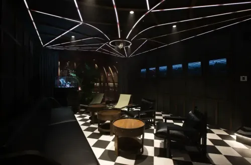 Intimate Luxe Lounge With Geometric Ceiling and Futuristic Flair for VIP Evenings