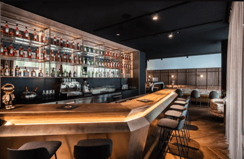 Modern Dining & Bar With Dark Colour Palette for Classy Socials