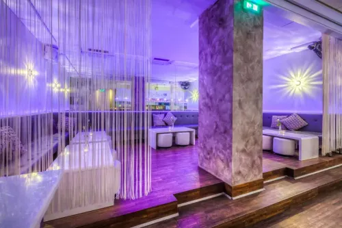 Vibrant Lounge With Neon Glow for Stylish Intimate Receptions