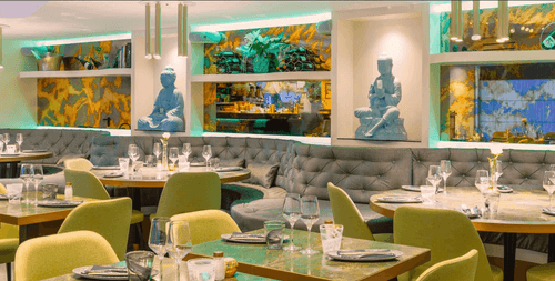 Terraced Restaurant Lounge With Buddha Sculptures & Emerald Marble Interiors