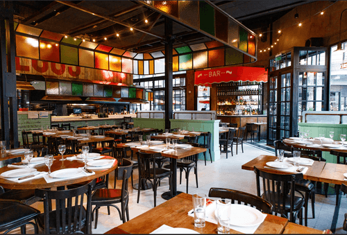 Lively Grill Restaurant with Colourful Industrial Design for Gatherings