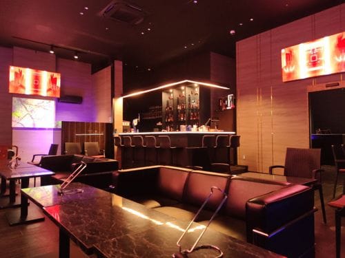 Opulent VIP Lounge With Textured Walls and Leather Seating for Exclusive Celebrations