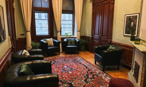 Timeless Art Nouveau Lounge With Vibrant Persian-Style Rug for Creative Events