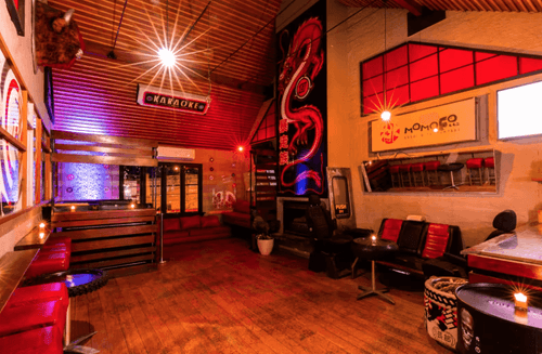 Vibrant Asian-Inspired Venue With Bold Murals and Cozy Atmosphere for Events