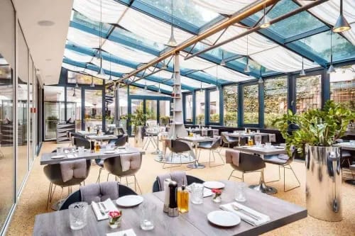 Elegant Glass-Enclosed Atrium for Scenic Private Luncheons