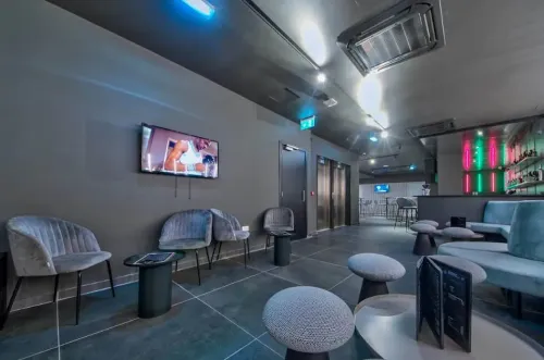 Grey-Toned Space With Aluminum Lounge