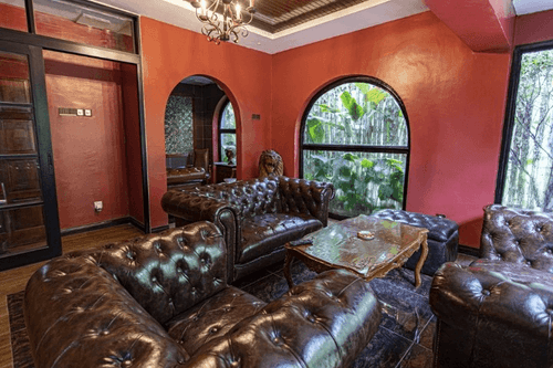 Luxurious Cigar Lounge With Arched Windows and Outdoor Views for Private Soirees