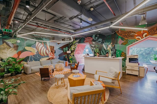 Creative Lounge With Murals and Arched Windows for Workshops