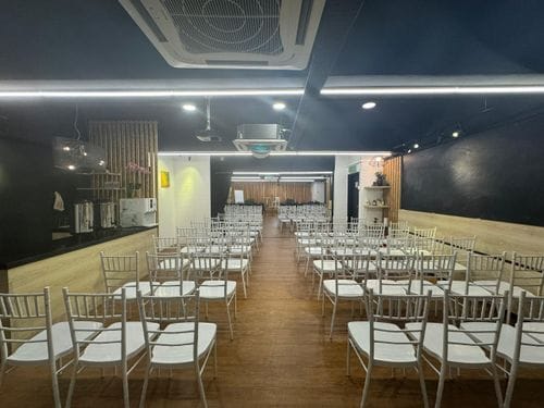 Cosy Contemporary Event Space Sith a Full-Wall Mirror and Ambient Disco Lighting for Dynamic Parties and Receptions