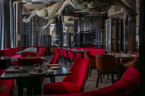 Dragon-Infused Dining Room With Deep Red Seating for Corporate Occasions