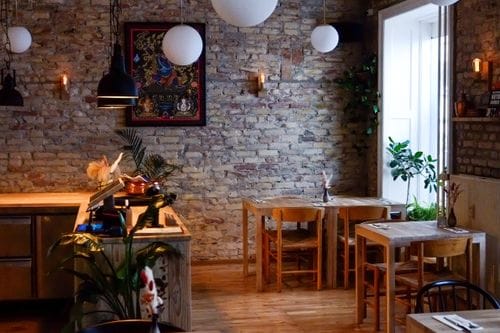 Rustic Brick-Walled Dining Space with Warm Lighting and Wood Details