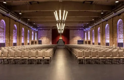 Red Brick Industrial Hall With Ambient Lighting for Corporate Conferences