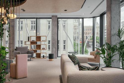 Urban Lounge With Floor-to-Ceiling Windows and Garden-Inspired Decor for Creative Events