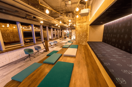 Inviting Auditorium with Wooden Benches and Warm Decor for Seminars