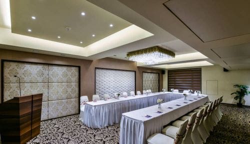 Crystal-Lit Conference Room With Textured Wall Panels for Seminars