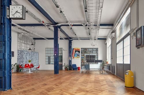 Spacious Industrial Venue With Colourful Art and Modern Aesthetic for Creative Events