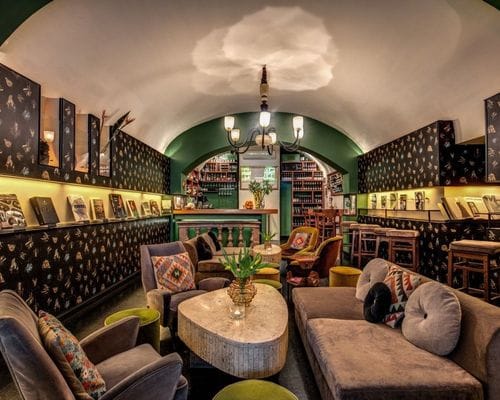 Chic Vaulted Lounge With Outdoor Seating and Vintage Touches for Stylish Events