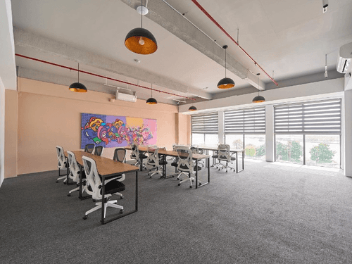 Unadorned Open-Plan Meeting Room With Wall Art for Group Sessions