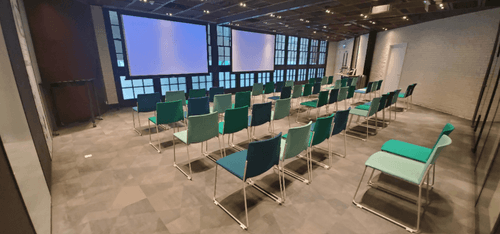 High-Tech Blue Venue With Expandable Auditorium for Futuristic Events